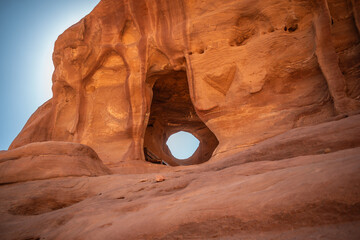 Rock Formation of Hole in Stone in Petra. Rocky Texture with Blue Sky in Wadi Musa. Outdoor Sadstone Window in Jordan.