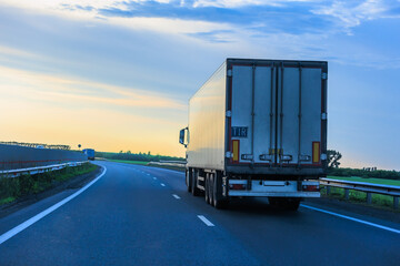 truck moves around a bend in a country