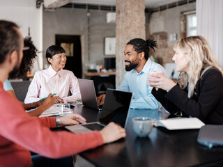 Diverse Team Engaged in Productive Business Meeting Discussion