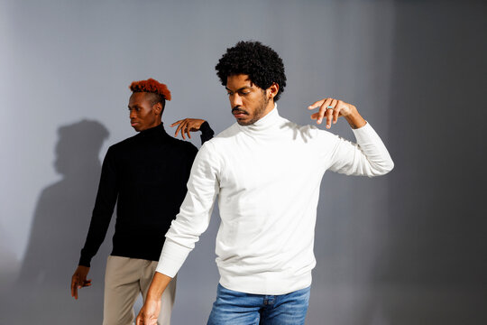 male models pose in modern turtleneck sweaters 