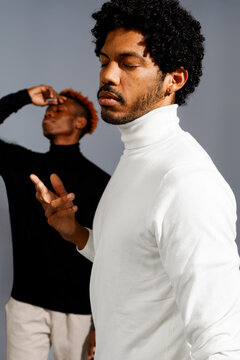 Two men expressing emotions through gesture 