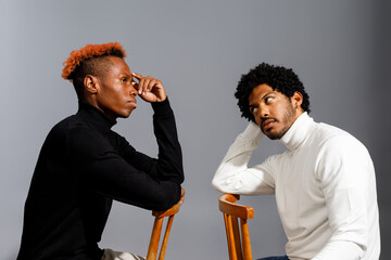 Two men engaged in deep conversation