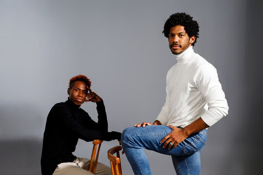 Two men posing in stylish clothing 