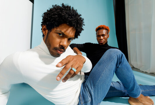 Two men posing in stylish casual clothing 