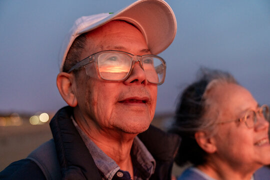 Content faces watching sunset