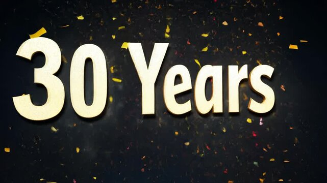 30 years celebration banner with confetti falling from the top. The banner is gold and black