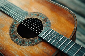 Obraz premium Classical guitar close up. Acoustic guitar on wood background.Music instrument concept