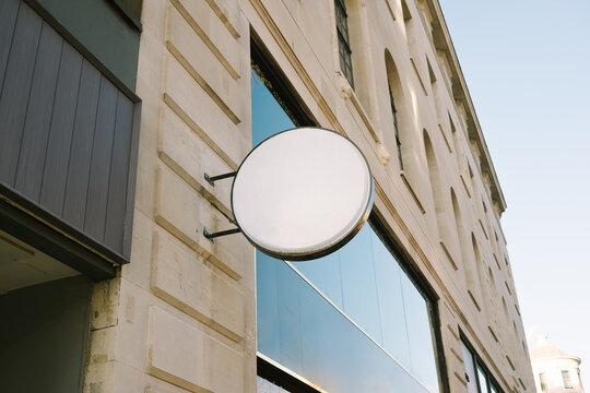 Round Sign on Building Facade