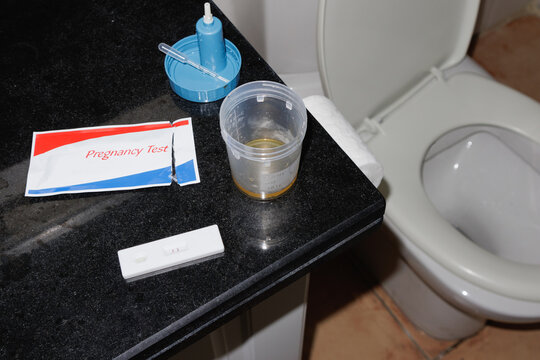 pregnancy test on the toilet counter