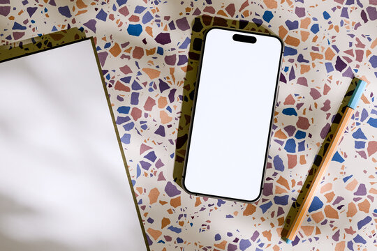 Smartphone on Terrazzo Surface with Notepad and Marker Pen