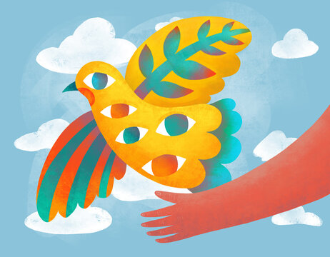 A vibrant yellow bird with patterns flying above a hand
