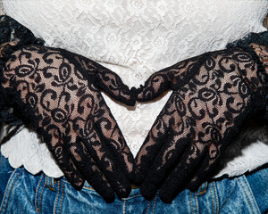 black lace gloves over white lace shirt