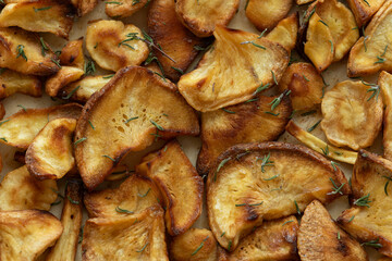 Top viev of parsnip chips with thyme.