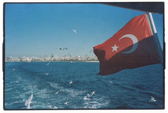 A stunning view of the Turkish flag fluttering on a boat 