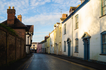 Picturesque english town with blue sky and warm morning light