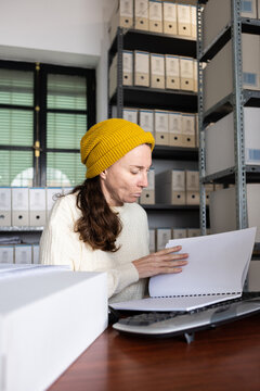 An archivist checking business documents
