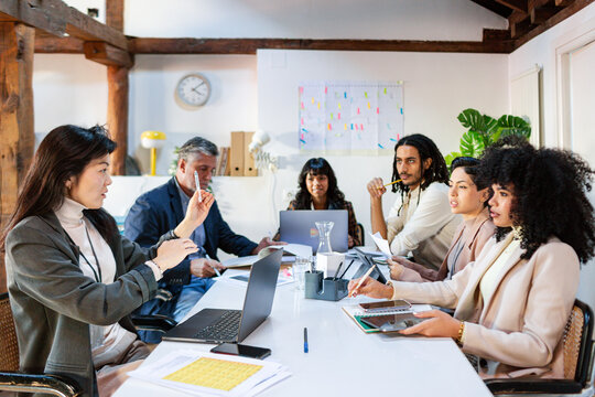 Diverse Business team in work meeting listening to project leader 