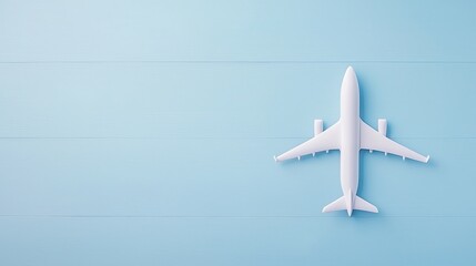 Fototapeta premium Minimalistic White Airplane Model on Soft Blue Background