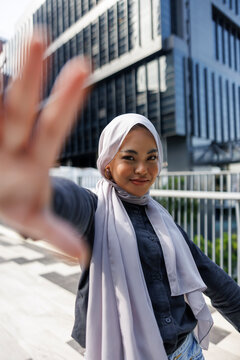 Portrait of carefree young woman gesturing
