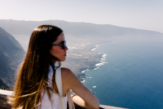 Seascape seen from La Peña with a lady out of focus in foreground