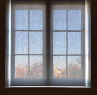 semi transparent blind in front of window