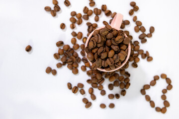 coffee grains falling into a cup or cupcake with coffee inside and symbols around it, creating a background