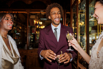 Friends enjoying cocktails and celebrating new year's eve ugc