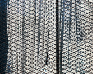 Window with lace curtains covered by protective security panel