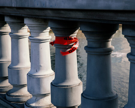 red tape attached to bridge post fluttering in wind
