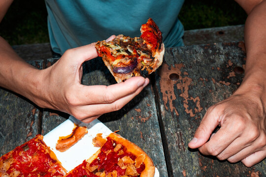 man about to eat spanish coca de verdurasman about to eat spanis