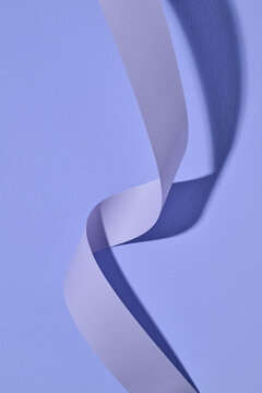 Abstract Purple Ribbon on Textured Background Design