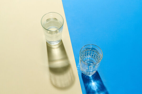 Minimalist Composition With Two Glasses Of Water In Color Contra