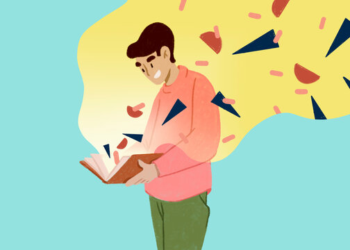 Male student reading book