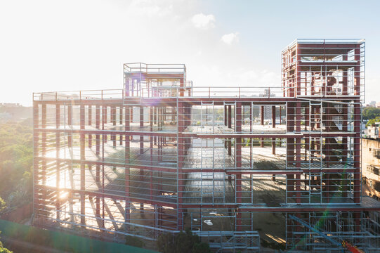 Aerial view of a steel - framed building under construction.