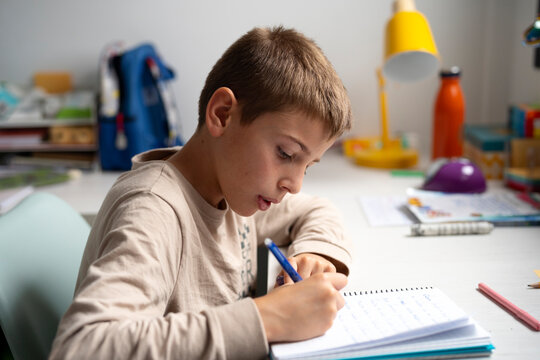 doing homework in his room