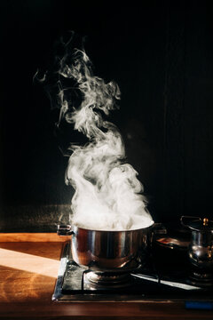 Boiling pot with rising steam