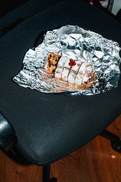 sliced christmas stollen on an swivel chair