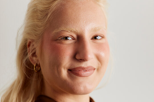 Face portrait of a blonde woman in studio