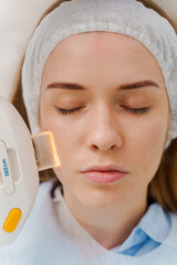IPL face pigmentation therapy by beautician. Ultrasound laser facial pigmentation treatment in...