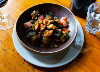 Mediterranean cuisine - mussels and tomatoes with arugula pesto