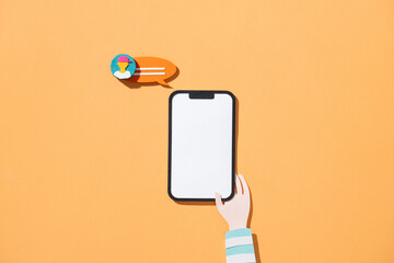 Creative Concept of Smartphone with Chat Bubble on Orange Background