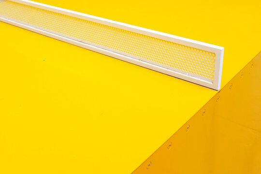 Close-up of modern minimal colourful yellow sport ping pong table 