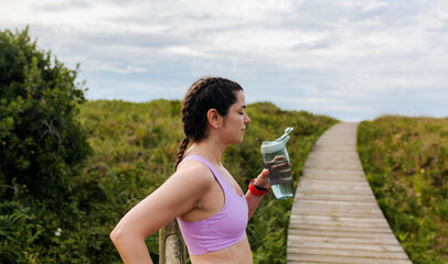 Woman Hydrating Outdoors
