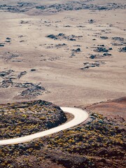 Meandering path towards the Piton de la Fournaise in a volcanic landscape