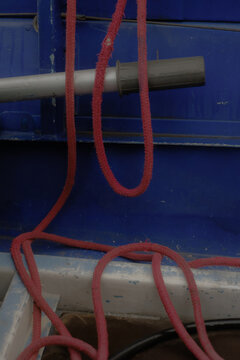 Nautical Equipment with Red Rope and Blue Background