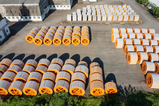 Aerial View Industrial Cable Reels Storage Yard With Orange Spoo