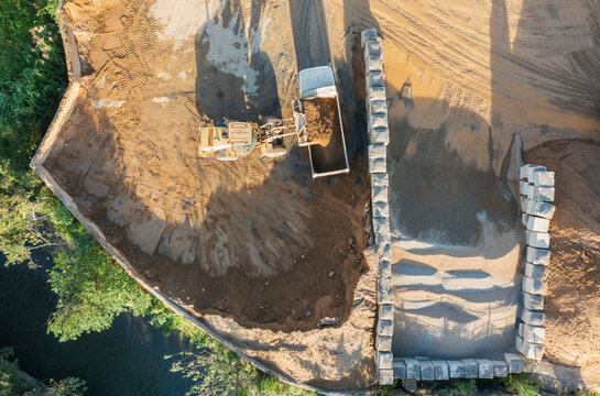 Aerial View of Excavator Working on Large-Scale Construction Sit