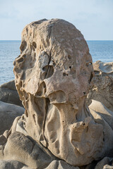Wind-eroded rocks illuminated by the sun in the beautiful Punta Molentis beach in Villasimius