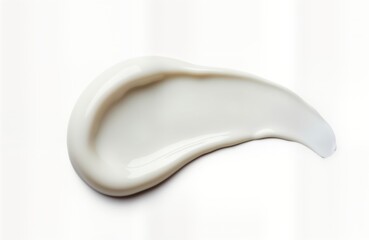 White cream smudge isolated on white background. Creamy cosmetic product sample. Liquid texture. Looks like facial care make-up product. Elegant beauty shot. Perfect for product catalog, advertising