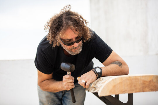 Carpenter using handtool